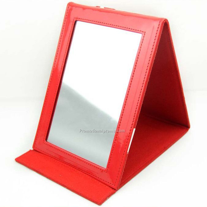 Folding travel mirror