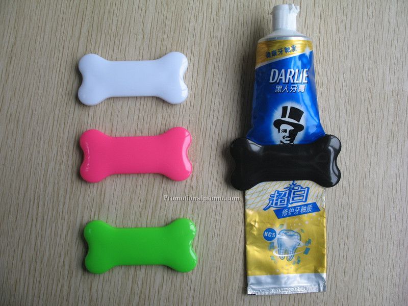 Bone shaped toothpaste squeezer