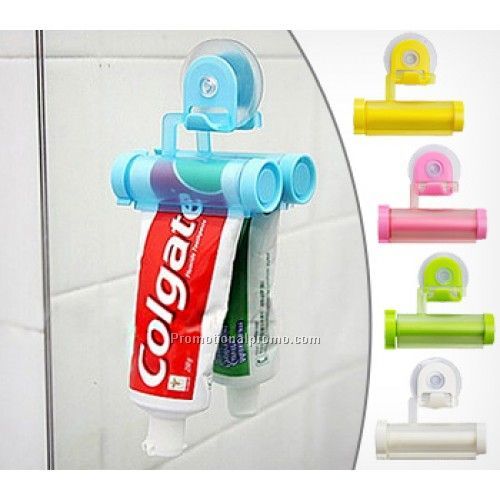 Hanging toothpaste tube squeezer with suction cup