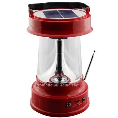 Portable integrated solar lantern with radio
